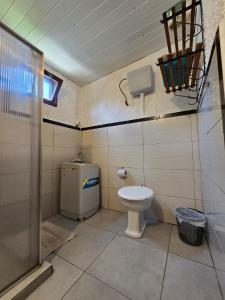 a small bathroom with a toilet and a window at Maridalba 1 in La Coronilla