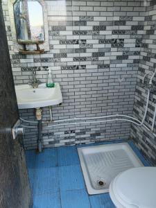 a bathroom with a sink and a toilet at Diar twins in Gabès