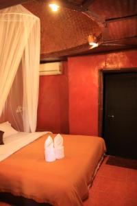 Postel nebo postele na pokoji v ubytování Ban Din Resort Chiang Rai