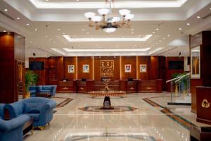 a court room with blue chairs and a table at Luxe Grand Hotel in Dubai +155 photos