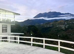 a balcony with a view of a mountain at Sanhill & Oasis in Ranau