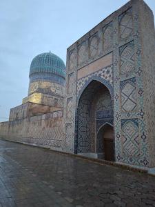 a building with a dome on top of it at Ramzan Family Guest House in Samarkand