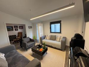 a living room with a couch and a table at Á-do-Couve in Alvito