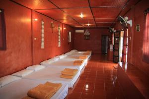 Postel nebo postele na pokoji v ubytování Ban Din Resort Chiang Rai