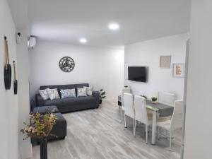 a living room with a couch and a table at Apartamento Grao in Gandía