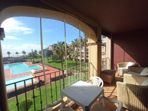 a balcony with a view of a swimming pool at ALCAUDÓN By SIT ISLA CANELA -REF 282- in Ayamonte