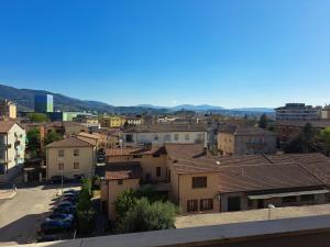 a city with cars parked in a parking lot at Campania Home in Terni