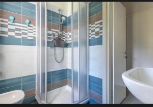 a bathroom with a shower and a sink at Casa Gaia a soli 20 mt dal mare in Pomonte