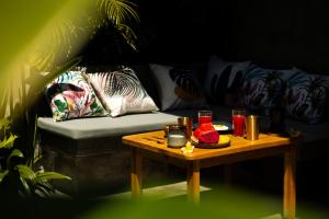 a living room with a couch and a table at Villa Naka - Gili Trawangan - Traditional Villa & Private pool in Gili Trawangan