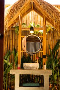 a bird house with a light on top of it at Villa Naka - Gili Trawangan - Traditional Villa & Private pool in Gili Trawangan