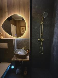 a bathroom with a sink and a mirror at Boutique Suite 02 Chic in Zadar +16 photos