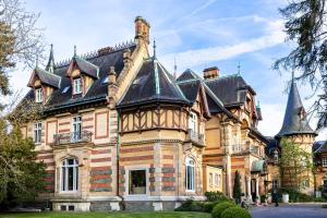 an old house with a turret at Villa Rothschild, Autograph Collection in Königstein im Taunus
