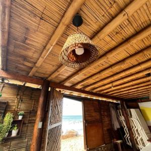 a ceiling of a room with a view of the beach at HospedajesPerú in Zorritos