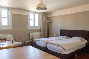 Ліжко або ліжка в номері tam tam city lodge