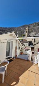 a view of a house with a patio at Studio décor chalet jusqu'à 6 couchages in Fontpédrouse