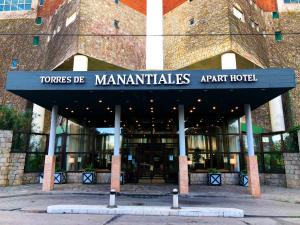 a building with a sign that readslords of manantisksark hotel at Torres de Manantiales Apart Hotel in Mar del Plata