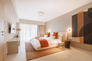 a bedroom with a large bed and a desk at Villa Erifyli in Aghia Marina +50 photos