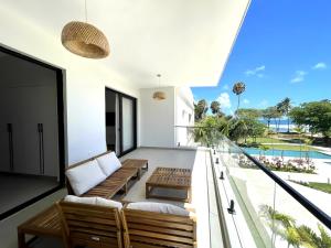 an open balcony with a view of the ocean at Beachfront Paradise - Huge Pool, Ocean View & Surf in Cabarete
