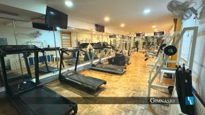 a gym with a bunch of treadmills and machines at Torres de Manantiales Apart Hotel in Mar del Plata