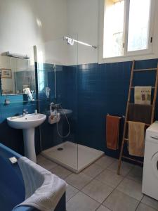 a bathroom with a shower and a sink and a toilet at Grande maison familiale proche mer in Elne +31 photos