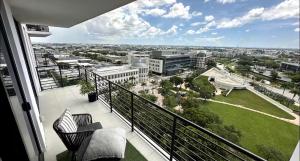 a balcony with a view of a city at Bonito doral in Miami