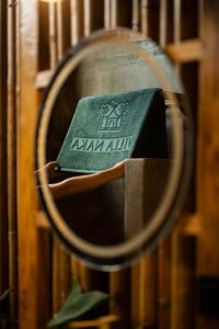 a book sitting on top of a rack at Villa Naka - Gili Trawangan - Traditional Villa & Private pool in Gili Trawangan