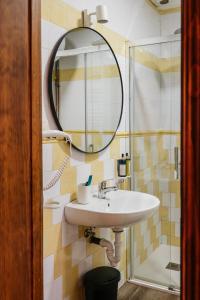 a bathroom with a sink and a mirror at Cuevas El Atochal Orígenes in Gor +45 photos