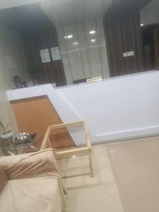 a room with a table and a chair and a mirror at De Hotel Veda Pvt Ltd in Thapathali