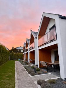an exterior view of a house with a patio at Nowa Stodoła in Władysławowo