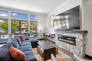 a living room with a couch and a fireplace at Downtown Gem in Whitefish