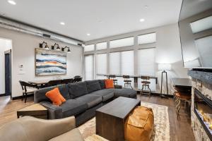 a living room with a couch and a table at Downtown Gem in Whitefish +32 photos