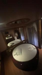 a bedroom with two beds and a toilet in it at Motel Viva Vez in Canoas