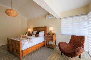 a bedroom with a bed and a desk and a chair at Spacious Villa in La Cuaba, Pool in Pedro Brand +67 photos