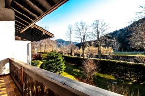 a view from the balcony of a house at Ferienwohnung Steinfeldstrasse am Tegernsee in Rottach-Egern +5 photos