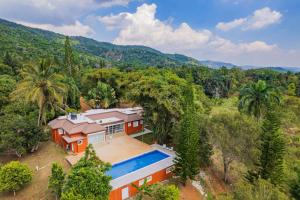 an aerial view of a house with a swimming pool at Spacious Villa in La Cuaba, Pool in Pedro Brand