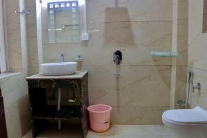 a bathroom with a sink and a shower at The Kun in Leh +28 photos