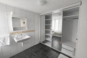 a bathroom with a sink and a walk in shower at JSM è in Därligen +65 photos