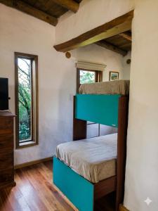 a bedroom with a bunk bed in a house at Casa Atardecer San Javier in San Javier
