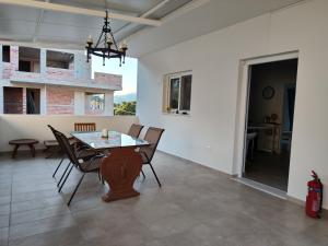 a dining room with a table and chairs at NMD house in Ermioni