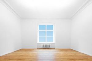an empty room with a window and a wooden floor at Pokój dla dwóch osób in Bilten