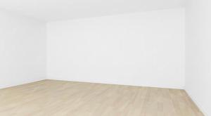 an empty room with a wooden floor and white walls at Pokój dla dwóch osób in Bilten