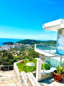 a view from the balcony of a house at Mistral Inn in Himare