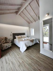 a bedroom with a large bed and a large window at Monte do Sol in São Luis +48 photos