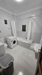 a white bathroom with a washing machine in it at Animus House #1 Apartment, Peraia in Perea +49 photos