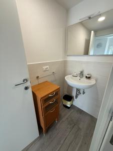 a bathroom with a sink and a mirror at Alba & Tramonto in Levanto +27 photos