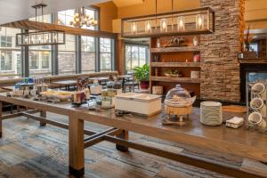 a large room with a table with food on it at Residence Inn by Marriott Helena in Helena