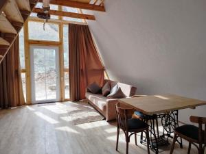 a living room with a couch and a table at Metsadzor Resort, Areni in Areni
