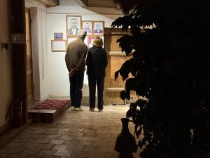 two people standing in a hallway looking at art at Usman Heritage in Bukhara
