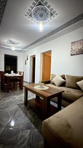 a living room with a couch and a table at Casa Si Ahmed in Chefchaouen