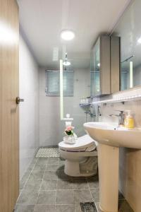 a bathroom with a toilet and a sink at 홍대 골든스테이 in Seoul +17 photos